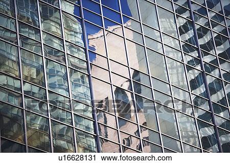Stock Image - Contemporary glass windows in skyscraper . Fotosearch
