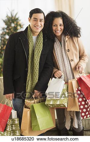 Couple with Christmas shopping View Large Photo Image Stock Image - Couple with Christmas shopping. Fotosearch