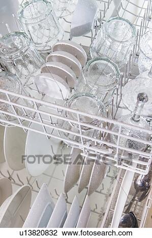 Stock Image - Crockery in dishwasher. Fotosearch