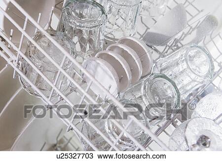 Stock Image - Crockery in dishwasher. Fotosearch