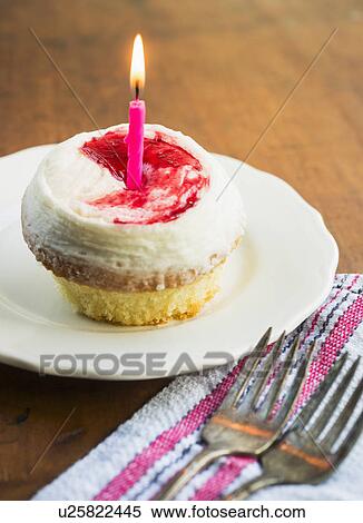 Stock Photography - Cupcake with candle. Fotosearch