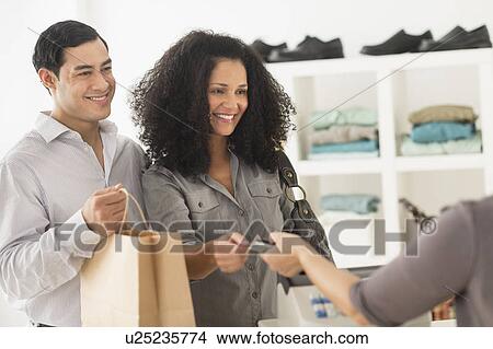 Customers and sales clerk in store View Large Photo Image Picture - Customers and sales clerk in store. Fotosearch