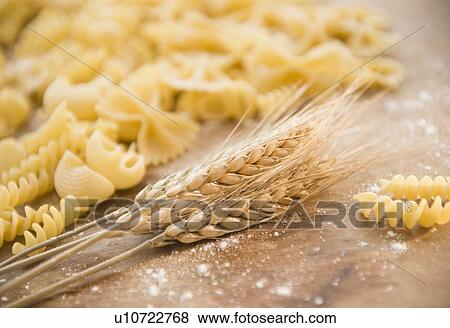 Stock Photo - Different types of pasta and wheat ear. Fotosearch
