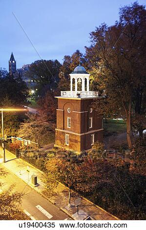 Stock Photography - Elevated view of clock tower at evening. Fotosearch