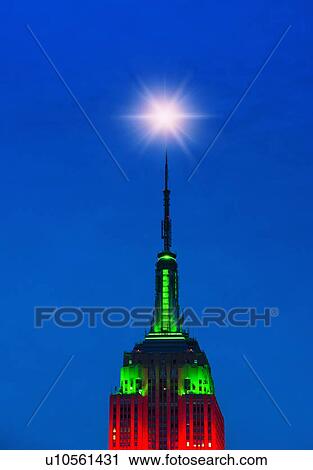 Empire State Building illuminated in red and green View Large Photo Image Stock Image - Empire State Building illuminated in red and green. Fotosearch