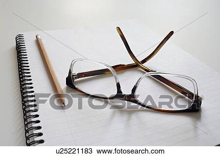 Stock Image - Empty note pad with pencil and spectacles. Fotosearch