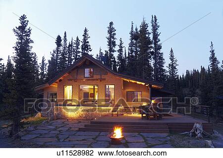 Stock Image - Fire pit in front of house. Fotosearch