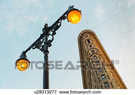 Stock Photo - Flatiron building with street lamp. Fotosearch