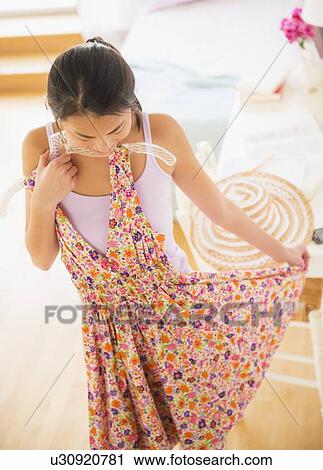 Front view of teenage girl ( 16-17 years) trying on dress View Large Photo Image Stock Image - Front view of teenage girl ( 16-17 years) trying on dress. Fotosearch