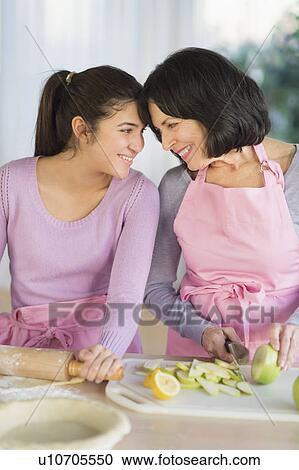 Grandmother and granddaughter (16-17) baking together View Large Photo Image Stock Image - Grandmother and granddaughter (16-17) baking together. Fotosearch
