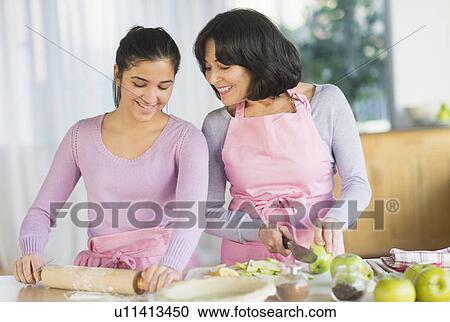 Grandmother and granddaughter (16-17) baking together View Large Photo Image Stock Image - Grandmother and granddaughter (16-17) baking together. Fotosearch