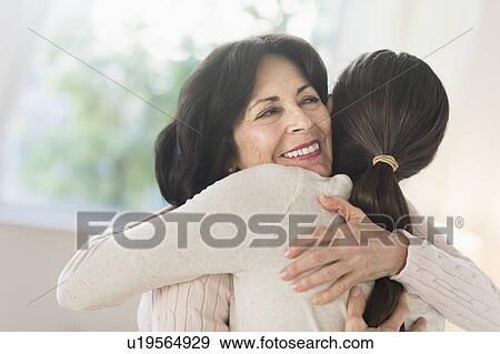 Grandmother and granddaughter (16-17) embracing View Large Photo Image Stock Photo - Grandmother and granddaughter (16-17) embracing. Fotosearch