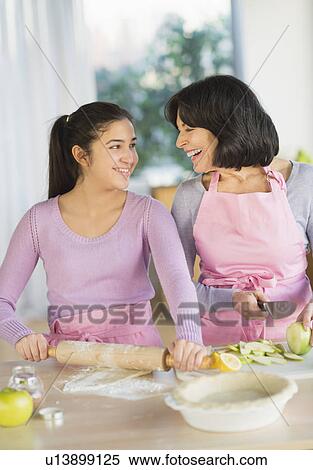 Grandmother and granddaughter (16-17) baking together View Large Photo Image Stock Photography - Grandmother and granddaughter (16-17) baking together. Fotosearch