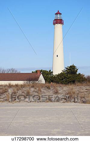 Lighthouse on beach View Large Photo Image Stock Image - Lighthouse on beach. Fotosearch