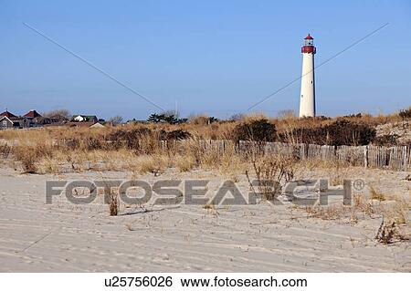 Stock Photograph - Lighthouse on beach. Fotosearch