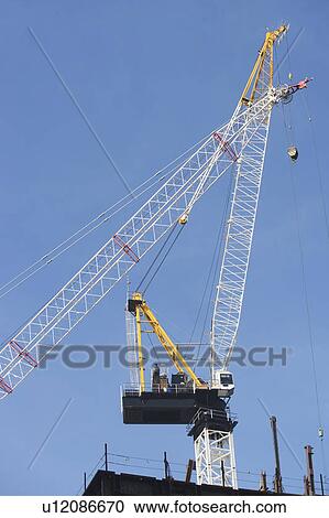 Stock Image - Low angle view of crane . Fotosearch