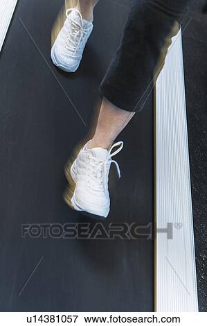 Stock Photo - Low section of woman on treadmill. Fotosearch