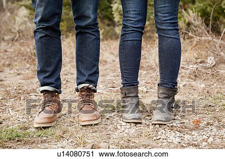 Low section of young people in denim jeans View Large Photo Image Stock Image - Low section of young people in denim jeans. Fotosearch