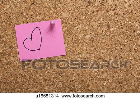 Picture - Note paper with drawn heart on corkboard . Fotosearch