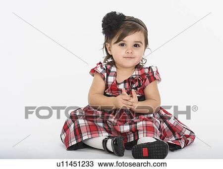 Portrait of Baby girl ( 6-11 months) wearing plaid dress View Large Photo Image Stock Image - Portrait of Baby girl ( 6-11 months) wearing plaid dress. Fotosearch