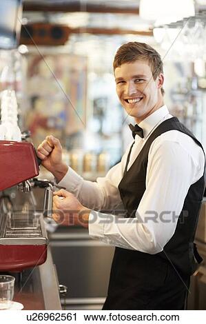 Portrait of barista standing by coffee maker View Large Photo Image Stock Image - Portrait of barista standing by coffee maker. Fotosearch