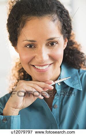 Stock Photo - Portrait of businesswoman in office . Fotosearch