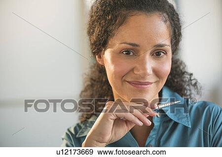 Portrait of businesswoman in office View Large Photo Image Stock Photo - Portrait of businesswoman in office . Fotosearch