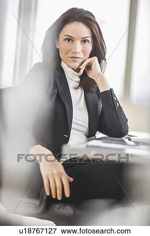 Portrait of businesswoman in office View Large Photo Image Stock Photo - Portrait of businesswoman in office. Fotosearch