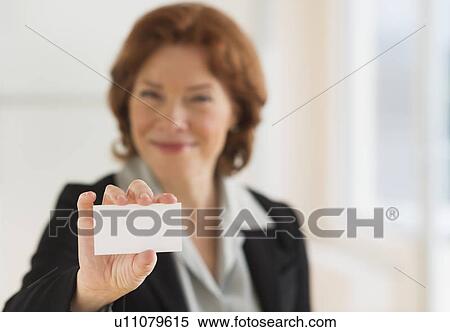Portrait of businesswoman showing blank business card View Large Photo Image Stock Photography - Portrait of businesswoman showing blank business card. Fotosearch