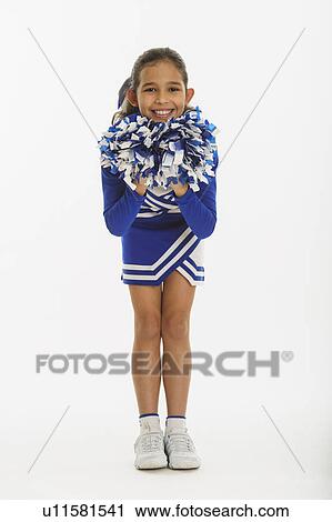 Stock Image - Portrait of cheerleader ( 10-11 years) holding pom-pom. Fotosearch