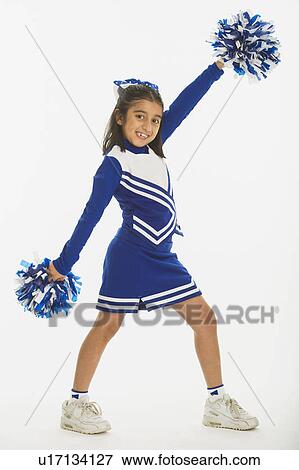 Stock Photo - Portrait of cheerleader ( 8-9 years) holding pom-pom. Fotosearch