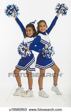 Portrait of cheerleaders (8-9 years) ( 10-11 years) holding pom-pom View Large Photo Image Stock Image - Portrait of cheerleaders (8-9 years) ( 10-11 years) holding pom-pom. Fotosearch
