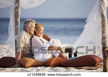 Stock Photo - Portrait of couple on beach. Fotosearch