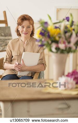Portrait of female artist in studio View Large Photo Image Stock Photo - Portrait of female artist in studio. Fotosearch
