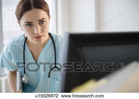 Portrait of female doctor in hospital uniform View Large Photo Image Stock Image - Portrait of female doctor in hospital uniform. Fotosearch
