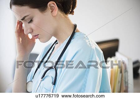 Stock Photo - Portrait of female doctor in hospital uniform. Fotosearch