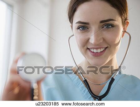 Stock Photography - Portrait of female doctor in hospital uniform with stethoscope. Fotosearch