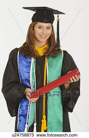 Portrait of graduate student holding diploma View Large Photo Image Stock Image - Portrait of graduate student holding diploma. Fotosearch