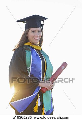 Portrait of graduate student holding diploma View Large Photo Image Stock Photography - Portrait of graduate student holding diploma. Fotosearch