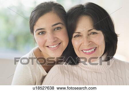 Stock Photo - Portrait of grandmother and granddaughter (16-17). Fotosearch