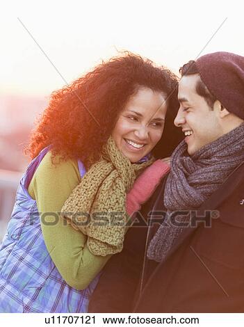 Portrait of happy couple embracing at sunset View Large Photo Image Stock Image - Portrait of happy couple embracing at sunset. Fotosearch