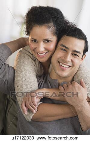 Stock Image - Portrait of happy couple embracing. Fotosearch
