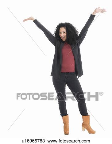 Stock Image - Portrait of mid adult woman gesturing, studio shot. Fotosearch