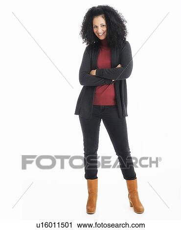 Stock Image - Portrait of mid adult woman, studio shot. Fotosearch