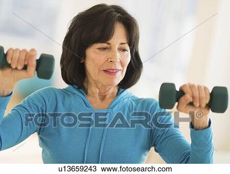 Portrait of senior woman exercising View Large Photo Image Stock Image - Portrait of senior woman exercising. Fotosearch