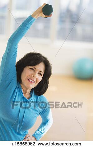 Portrait of senior woman exercising View Large Photo Image Stock Image - Portrait of senior woman exercising. Fotosearch