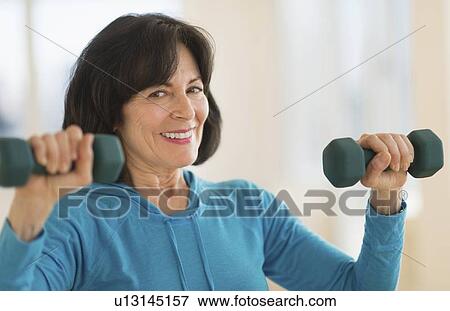 Portrait of senior woman exercising View Large Photo Image Stock Photo - Portrait of senior woman exercising. Fotosearch