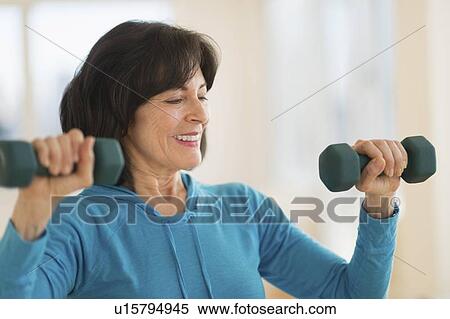 Portrait of senior woman exercising View Large Photo Image Stock Photography - Portrait of senior woman exercising. Fotosearch