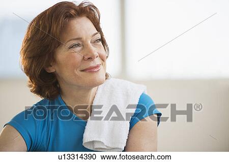 Stock Image - Portrait of senior woman in gym. Fotosearch