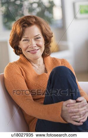 Portrait of senior woman relaxing on sofa View Large Photo Image Stock Photography - Portrait of senior woman relaxing on sofa. Fotosearch